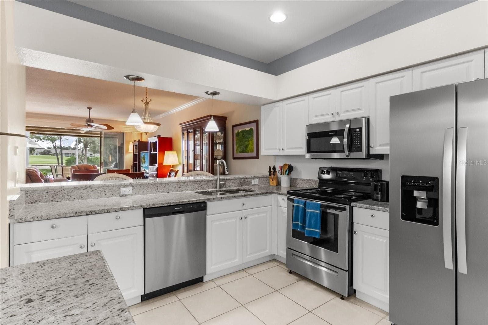Kitchen overlook into dining and living room - 5288 MAHOGANY RUN AVE, SARASOTA