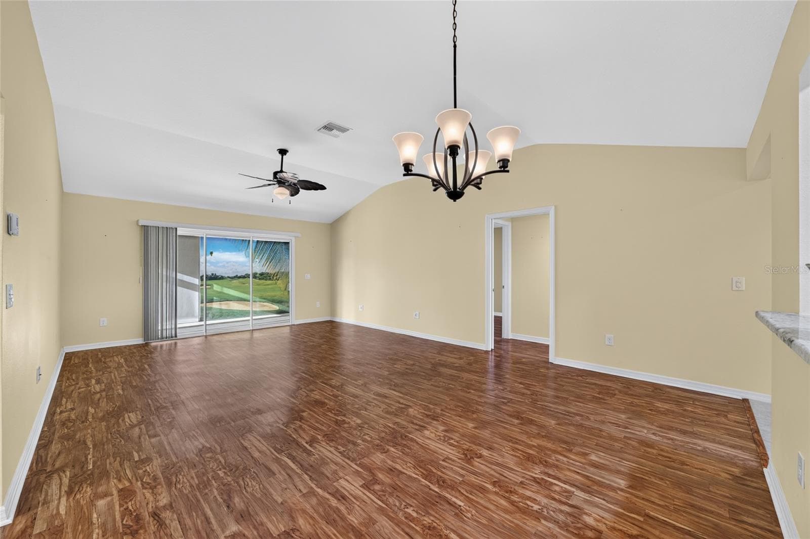 Glass slider doors from living room to glass enclosed florida room - 3552 WYNGATE PL, THE VILLAGES