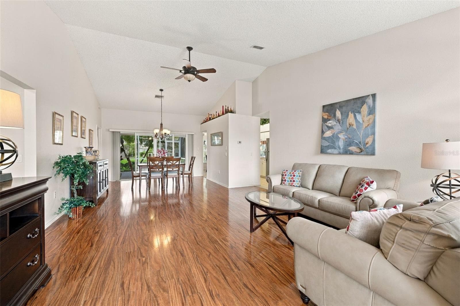 View as you enter the home with vaulted ceilings looking straight to the lanai - 1149 WOLFORD DR, NEW PORT RICHEY