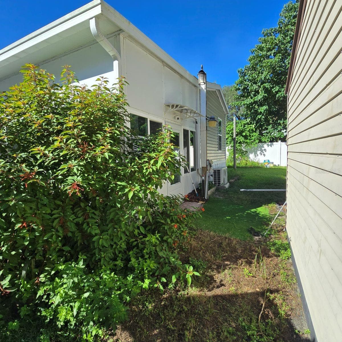 Back view of home - 9837 SE 160TH LN, SUMMERFIELD