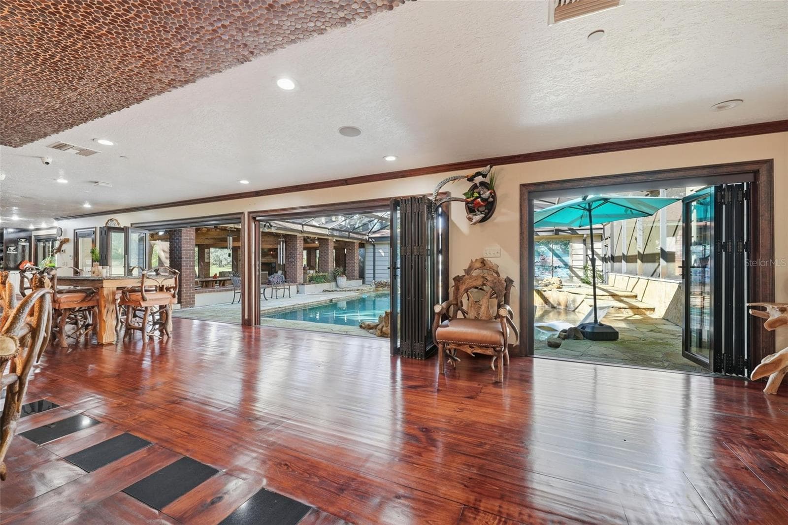 dining-living areas to pool view - 15211 VINOLA PL, MONTVERDE