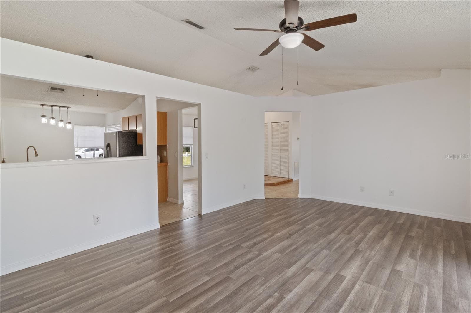 Living Room View To Kitchen - 2957 GIMLET DR, DELTONA