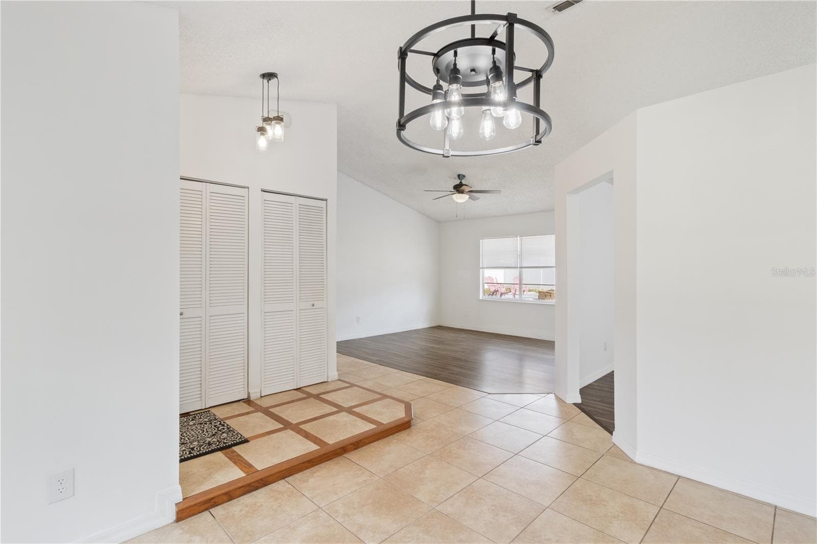View from Dining Area into Living Room and Entry - 2957 GIMLET DR, DELTONA