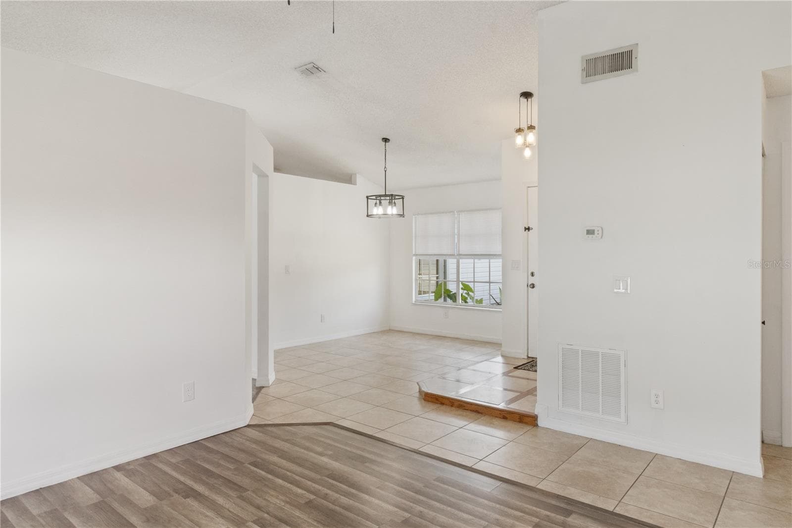 Living room into Dining room - 2957 GIMLET DR, DELTONA