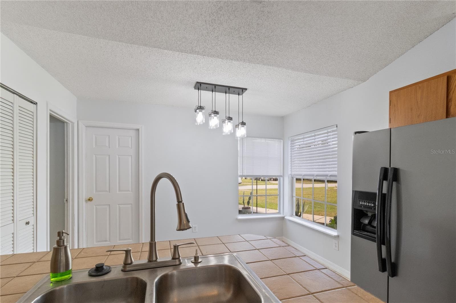 Kitchen looking into breakfast nook - 2957 GIMLET DR, DELTONA