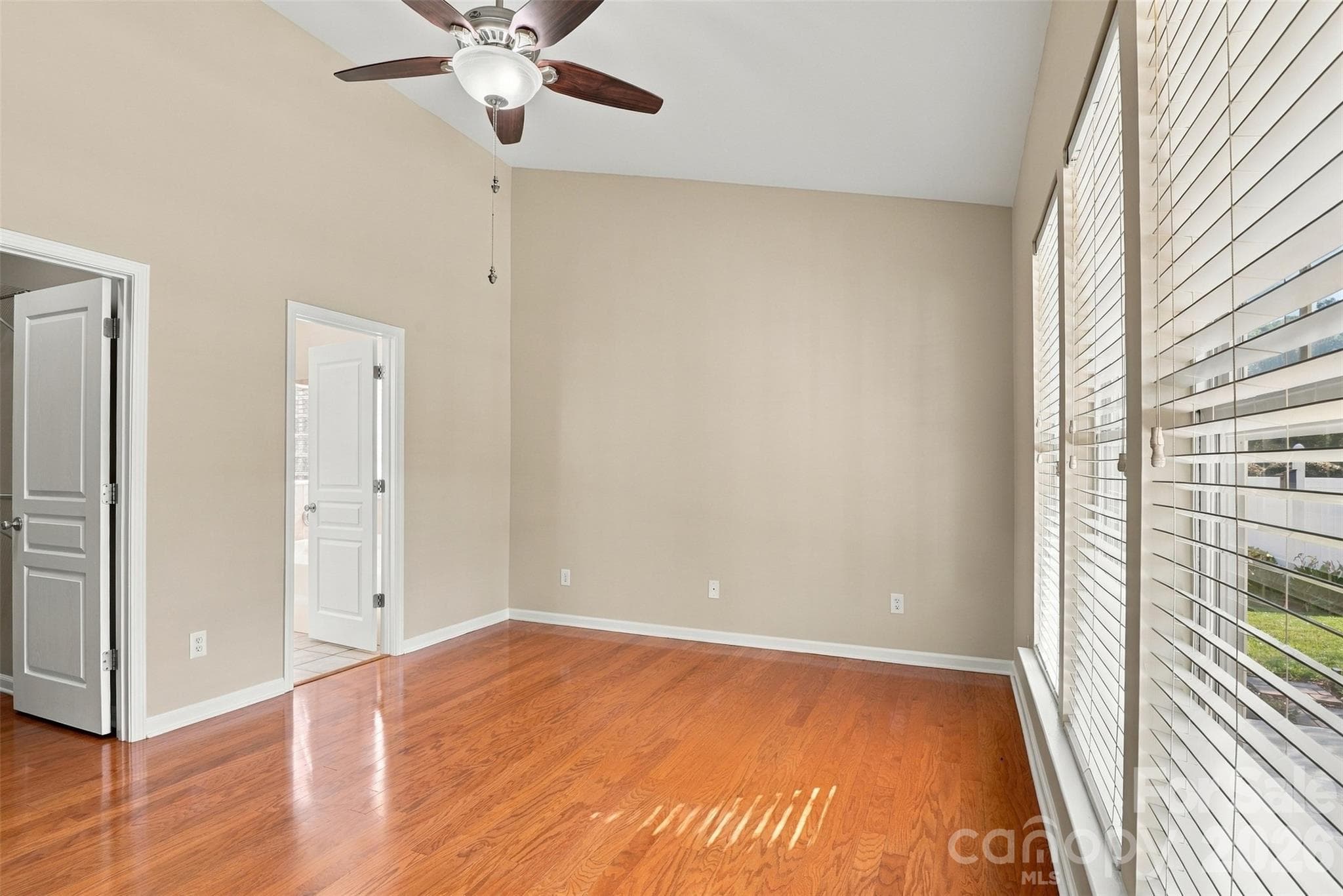 Primary suite with windows looking into the back yard. - 608 Goldflower Drive, Rock Hill