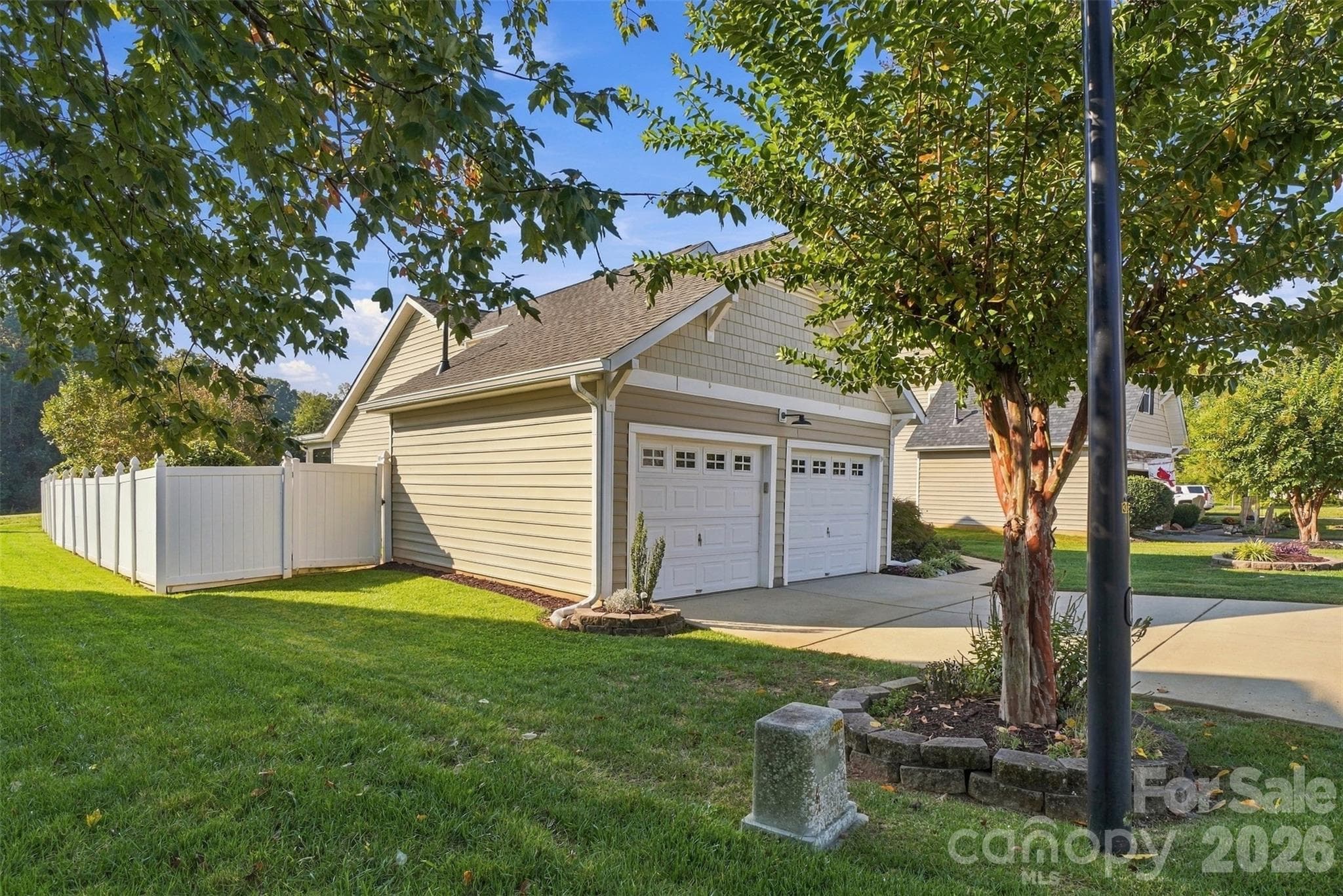 Side yard displays vinyl privacy fencing! - 608 Goldflower Drive, Rock Hill