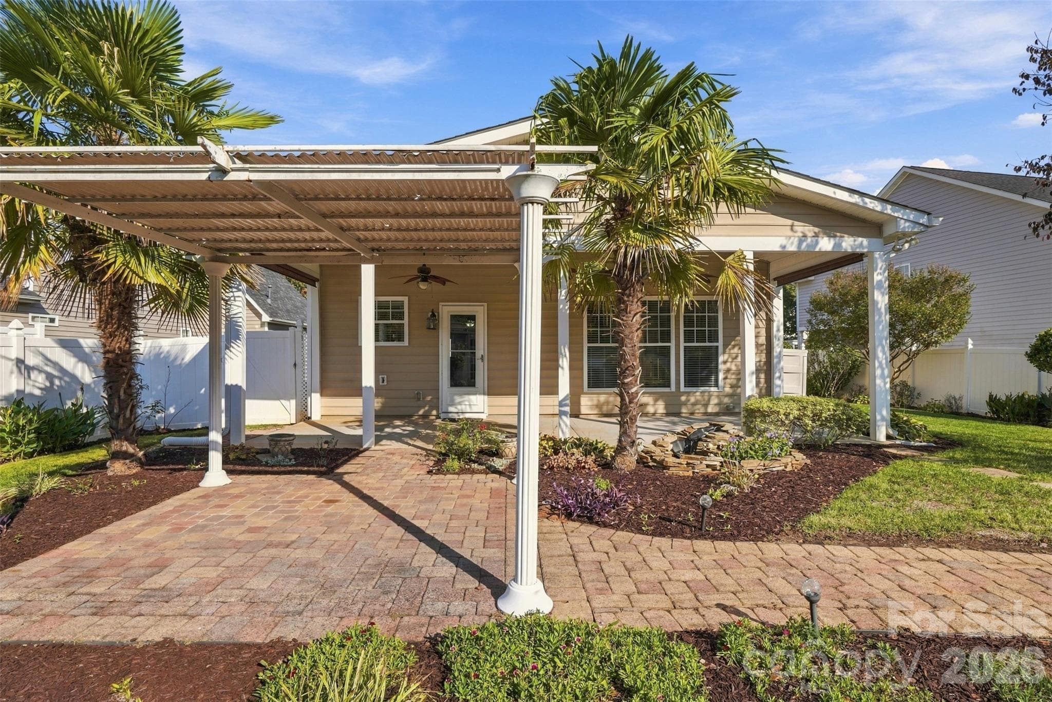 Beautiful back yard featuring large palm trees! - 608 Goldflower Drive, Rock Hill