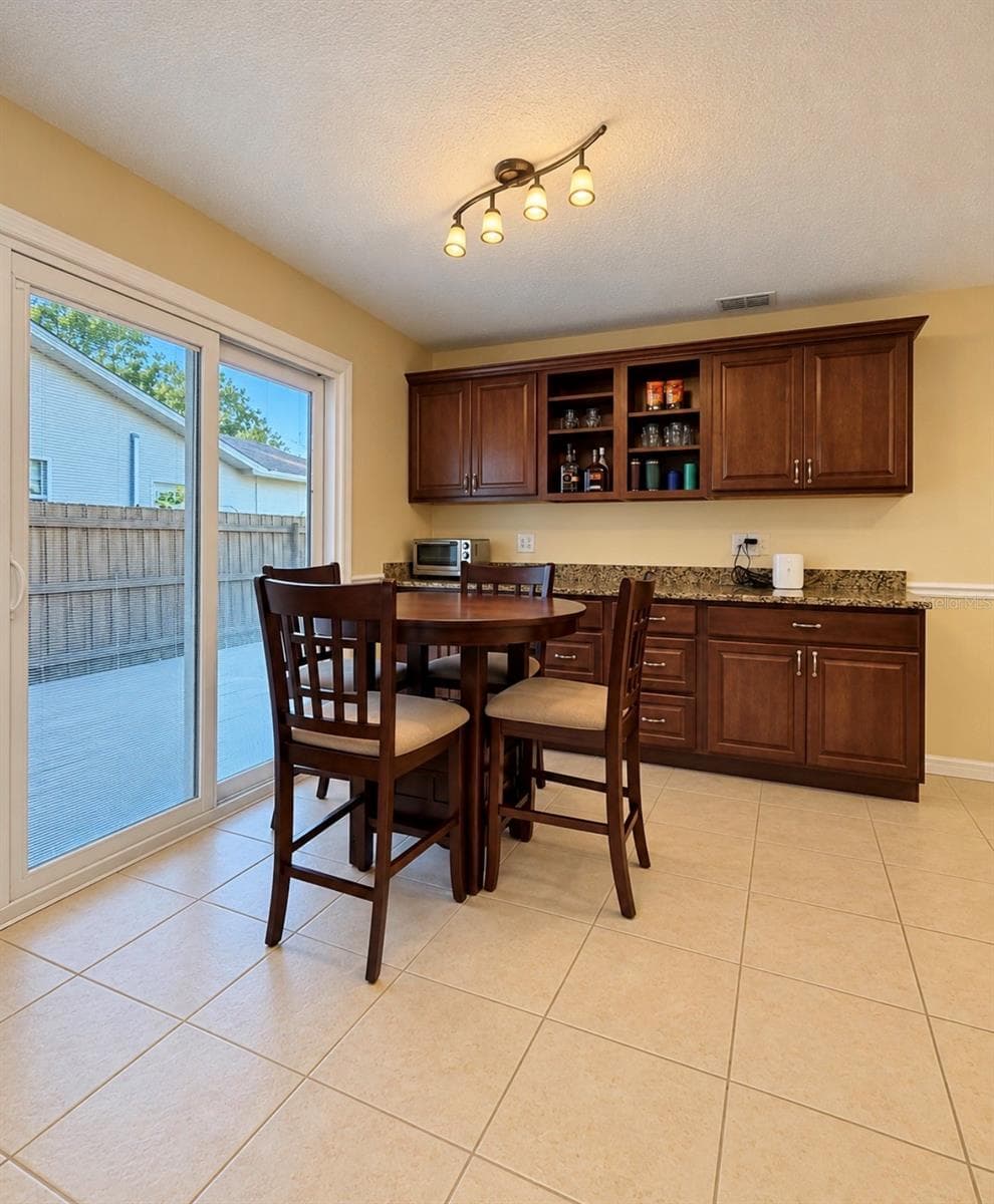 Dining with sliders to paver entertainment area - 1231 ROSEWOOD ST, LARGO