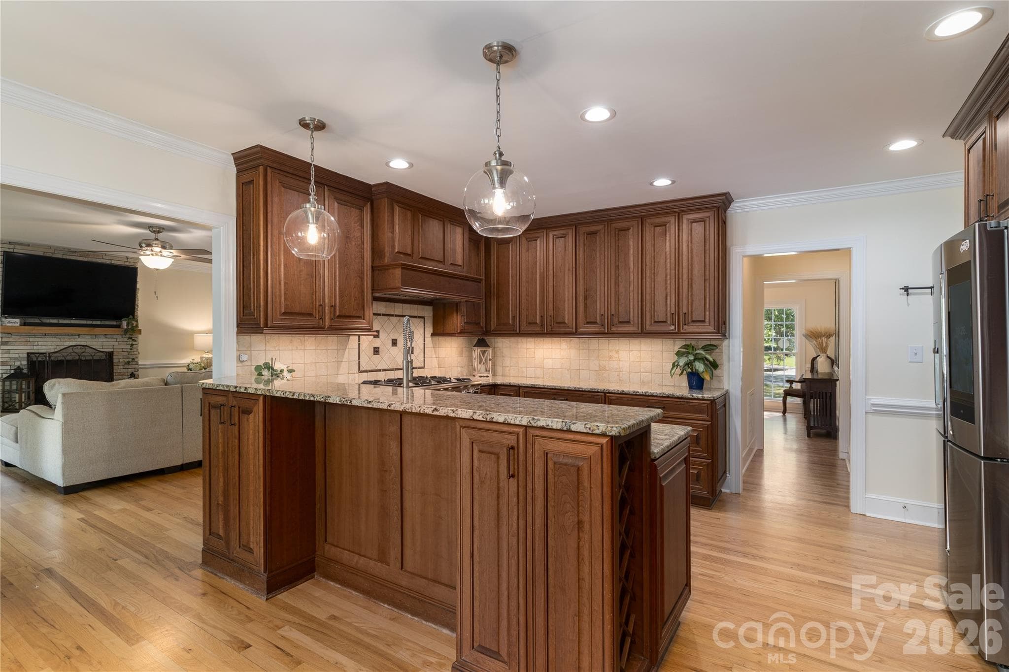 Entertain in the Chef's Kitchen with top of the line appliances and custom cabinetry - 16647 Greenfarm Road, Huntersville