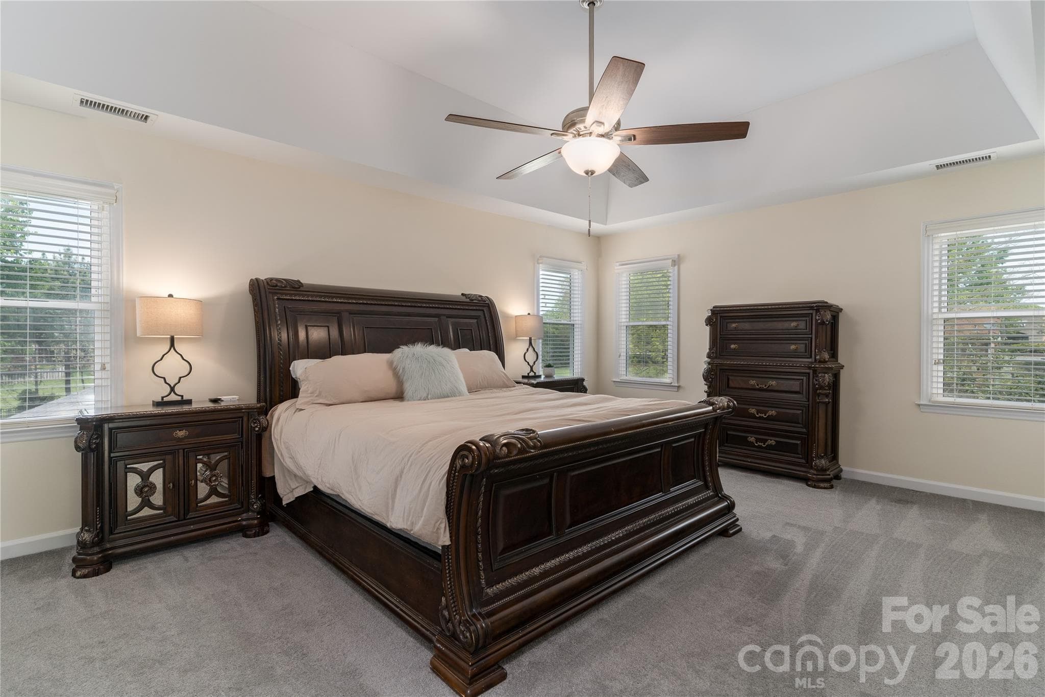Enjoying resting in the stunning Master Bedroom with vaulted ceilings - 16647 Greenfarm Road, Huntersville