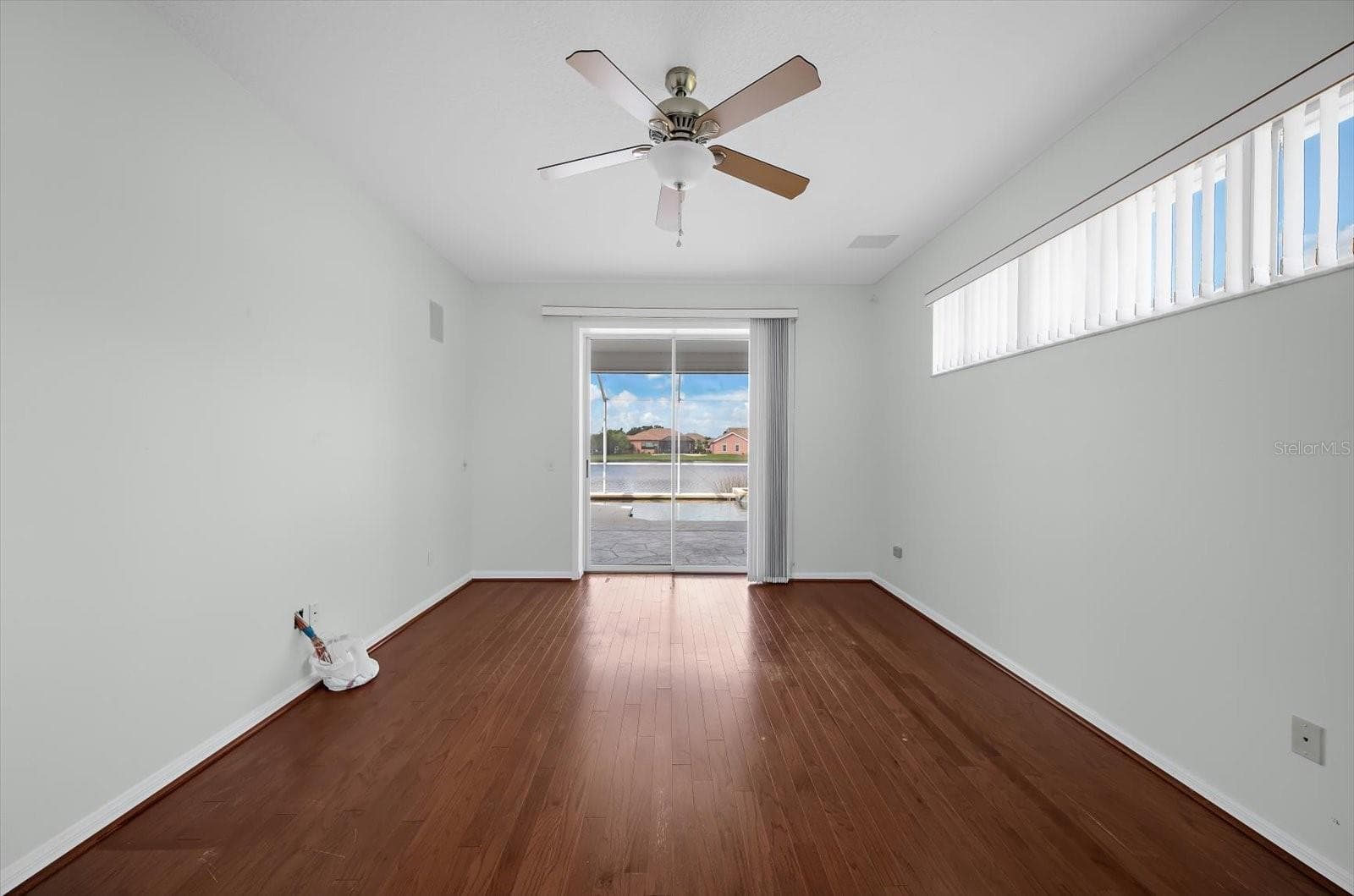Primary bedroom with sliding glass doors to the pool - 3715 72ND AVE. CIR E, SARASOTA