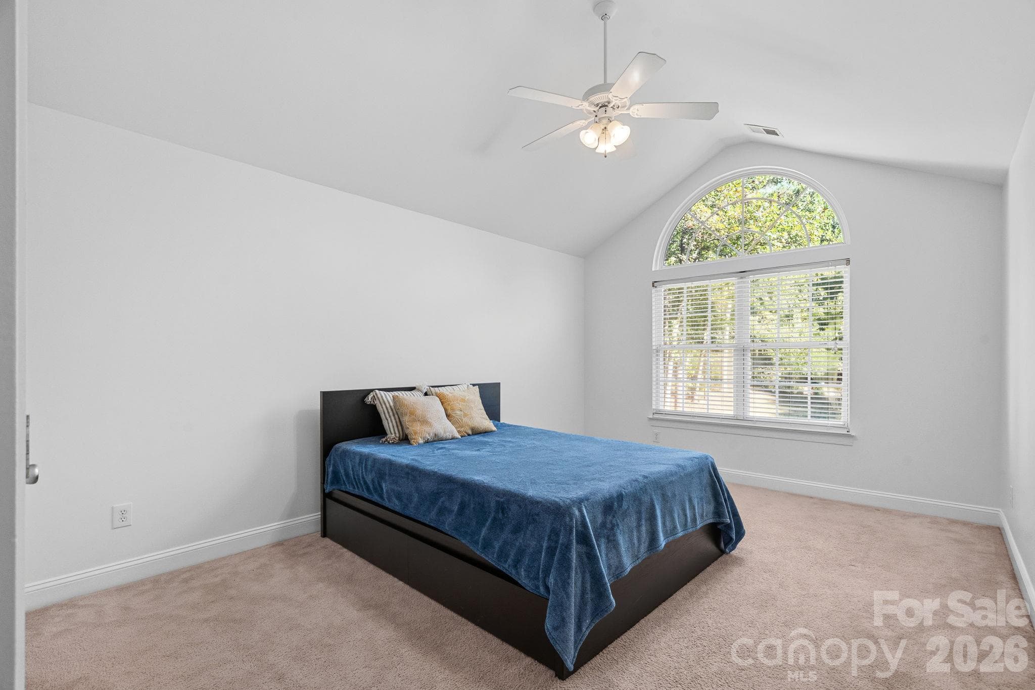 2nd upstairs bedroom with vaulted ceilings and a full bathroom outside the door - 148 Sunrise Circle, Mooresville