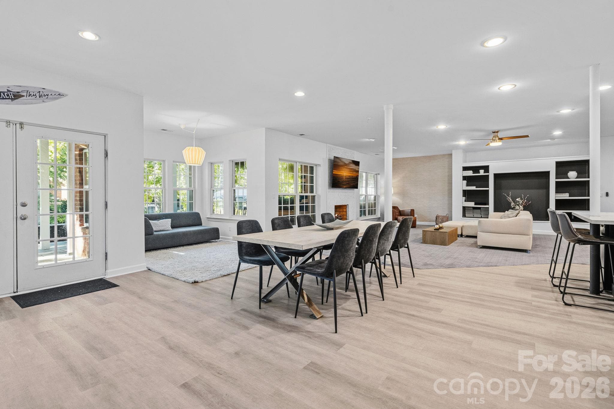 Open concept Basement area, dining room, sitting area, living space and access to the outdoor spaces and lake - 148 Sunrise Circle, Mooresville