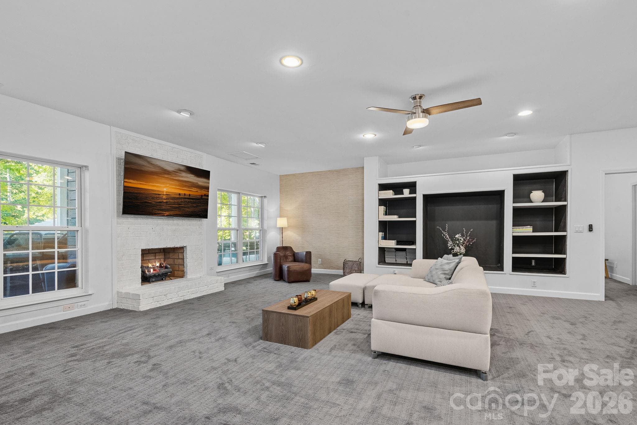 Basement living room with fireplace - 148 Sunrise Circle, Mooresville