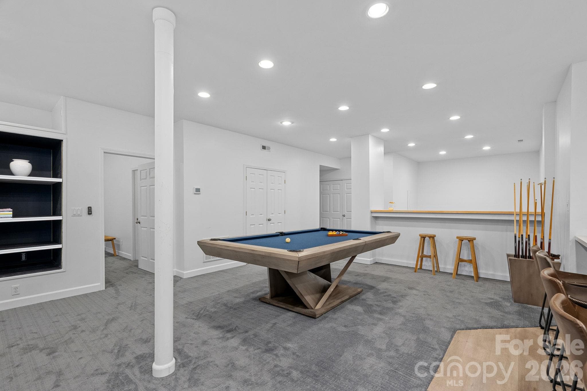 Extra space for a pool table and additional flex space beyond the bar area - 148 Sunrise Circle, Mooresville