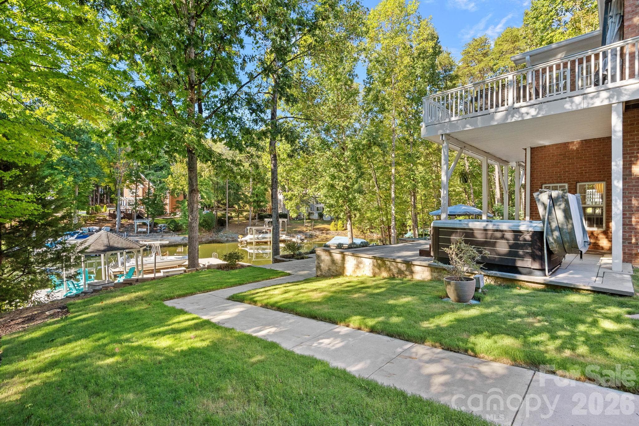 Left side of house with grass and access to the water - 148 Sunrise Circle, Mooresville