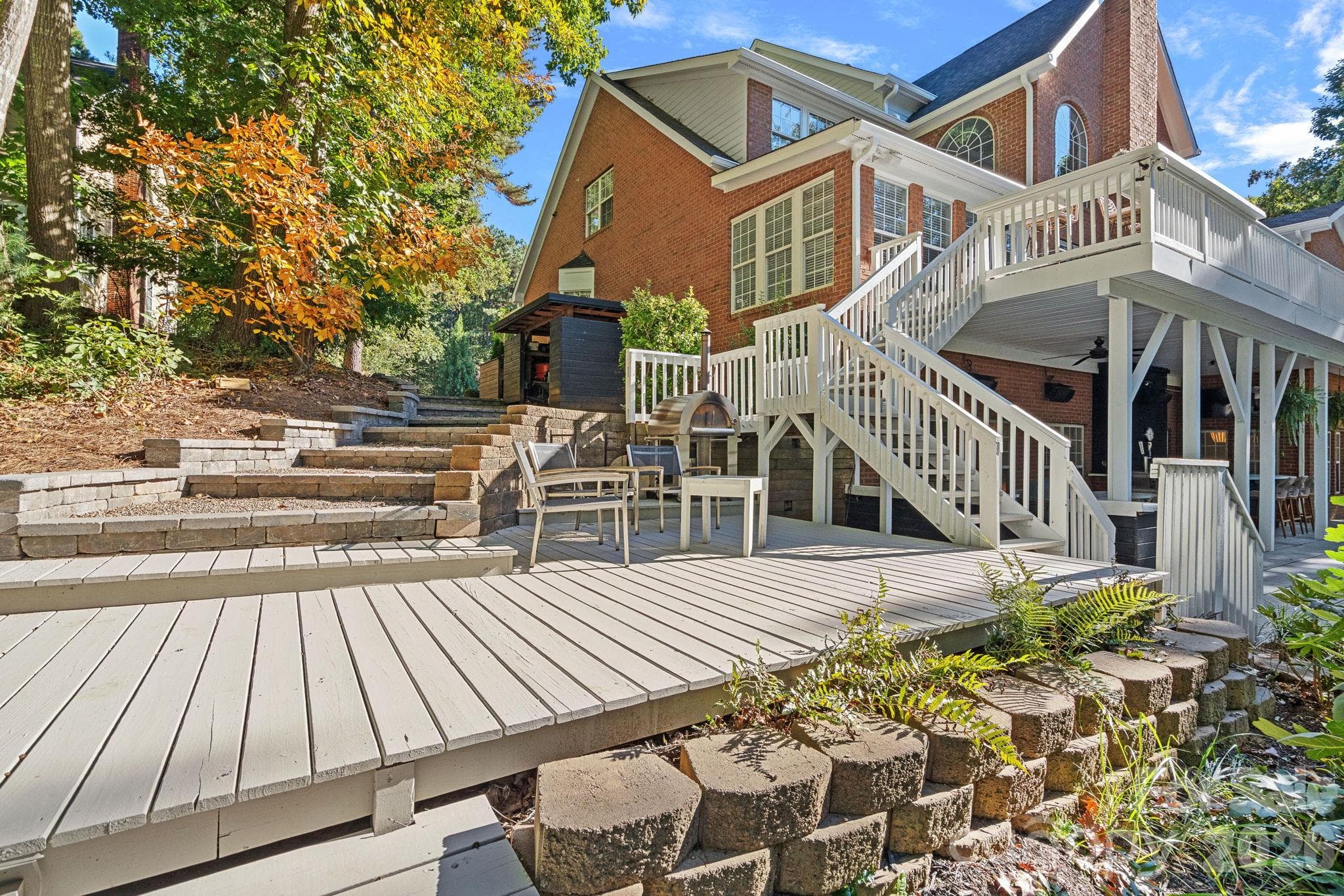 Right side of the house includes additional seating areas and wide steps to the backyard - 148 Sunrise Circle, Mooresville