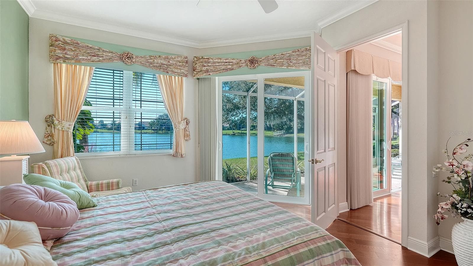 Master bedroom is positioned on the back of the unit to take advantage of the stunning lake views - 6531 MOORINGS POINT CIR #102, LAKEWOOD RANCH