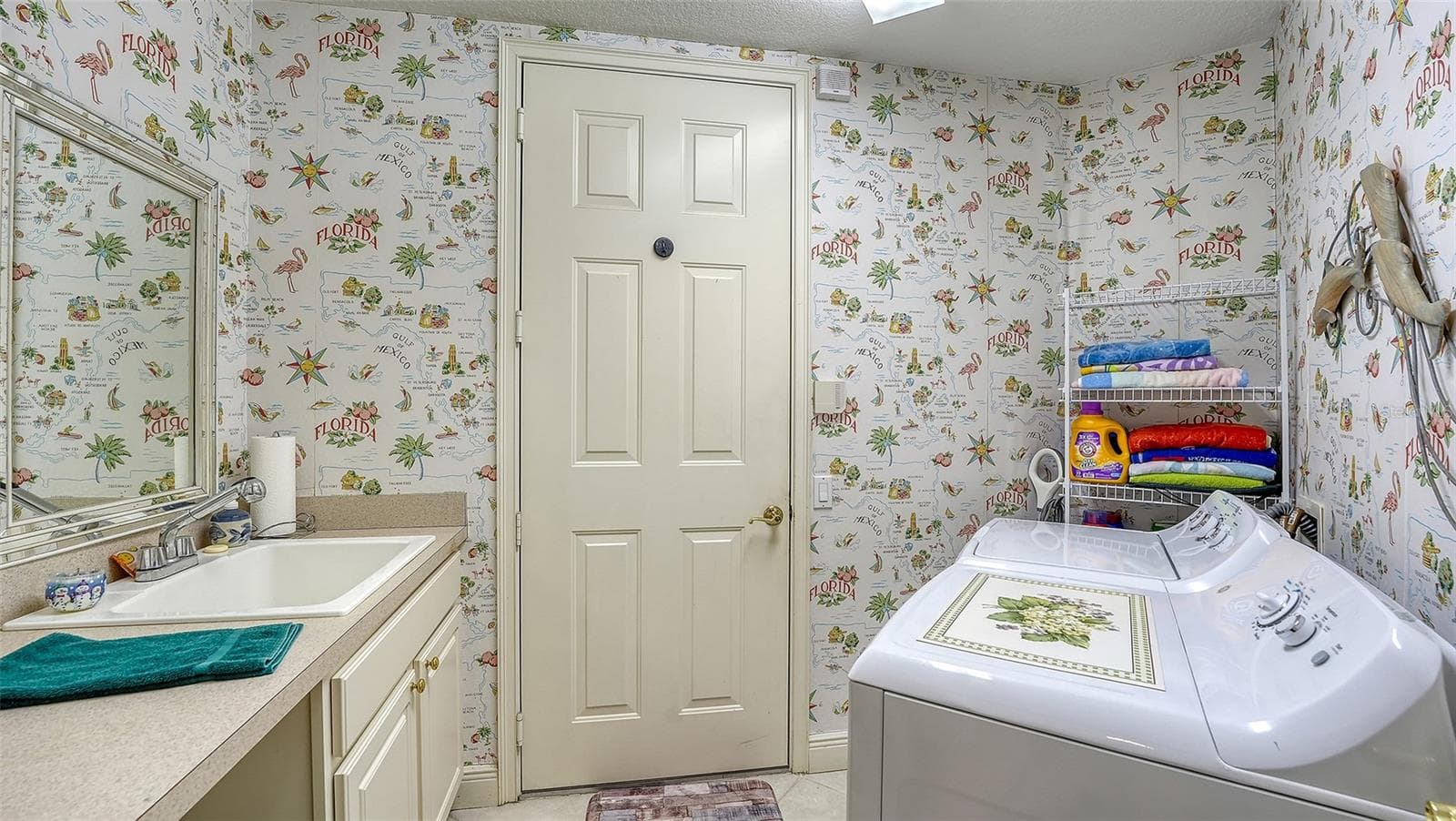 Large laundry room with newer washer and dryer replaced in 2024 - 6531 MOORINGS POINT CIR #102, LAKEWOOD RANCH