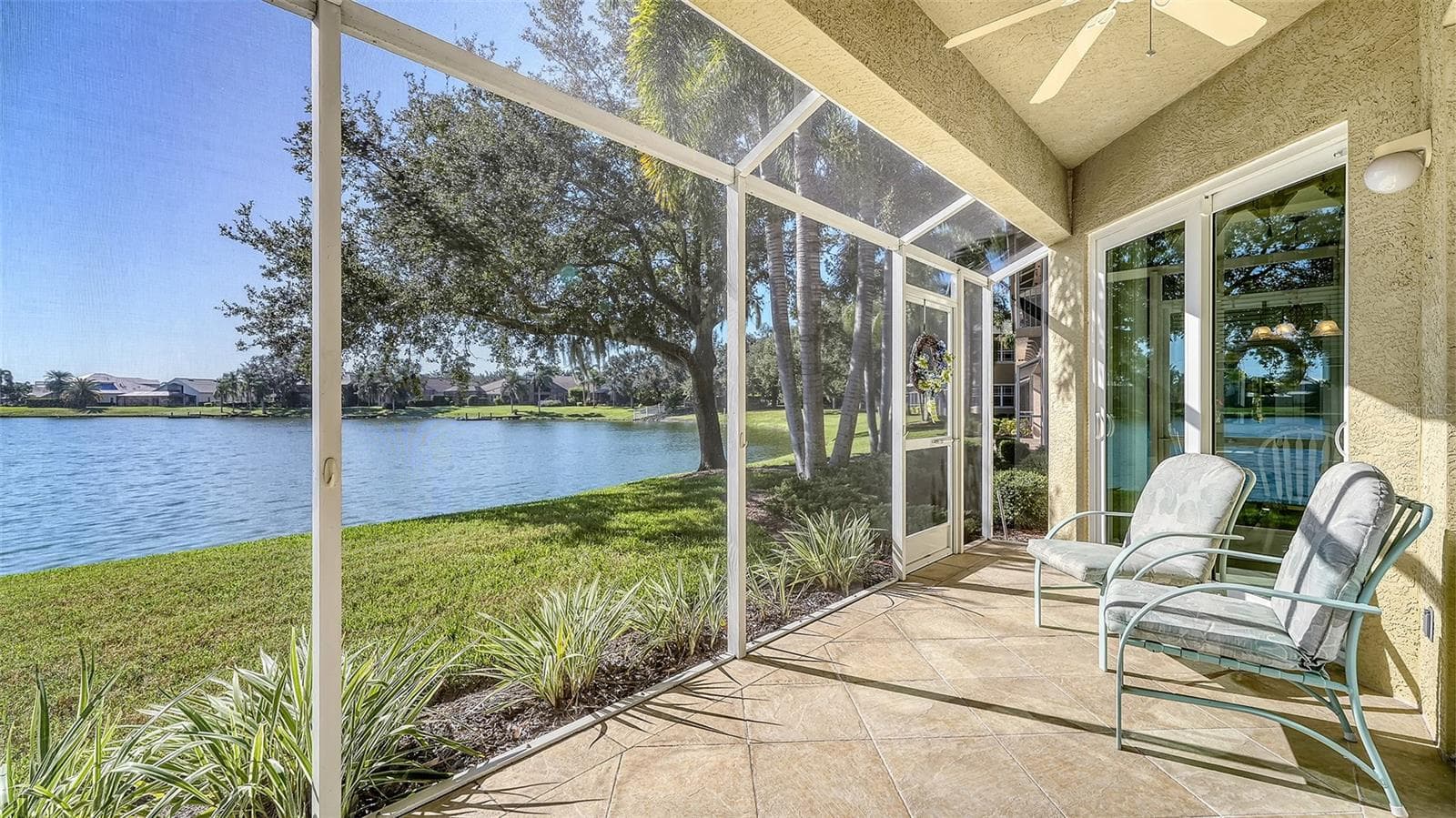 Plenty of room on the lanai to relax or entertain - 6531 MOORINGS POINT CIR #102, LAKEWOOD RANCH
