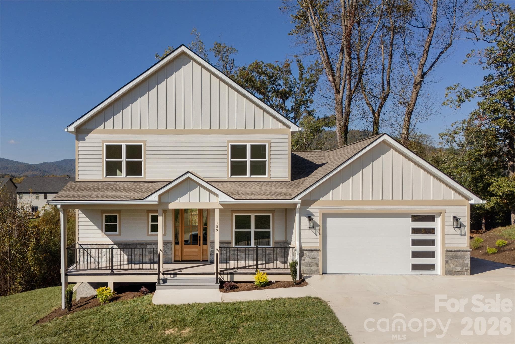 Front of home with large driveway - 159 Meadow Breeze Road, Arden