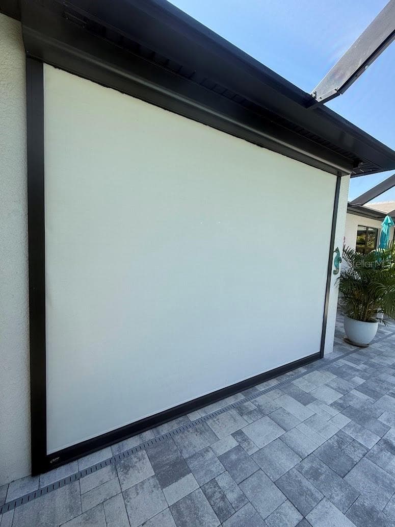Electric Remote Hurricane Screens to store your patio furniture! - 5437 SILVERSIDE PINE CT, LAKEWOOD RANCH