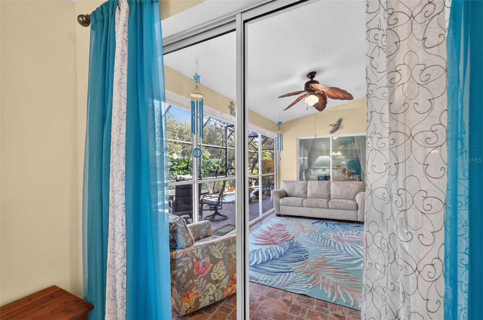 Primary Bedroom Sliding Glass Doors to Enclosed Lanai - 6121 HUNTERS RIDGE AVE, LEESBURG
