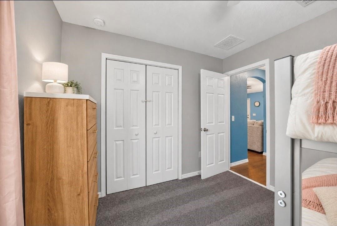 bedroom has virtual bedding. Furniture is present - 5413 NW 55TH CT, OCALA