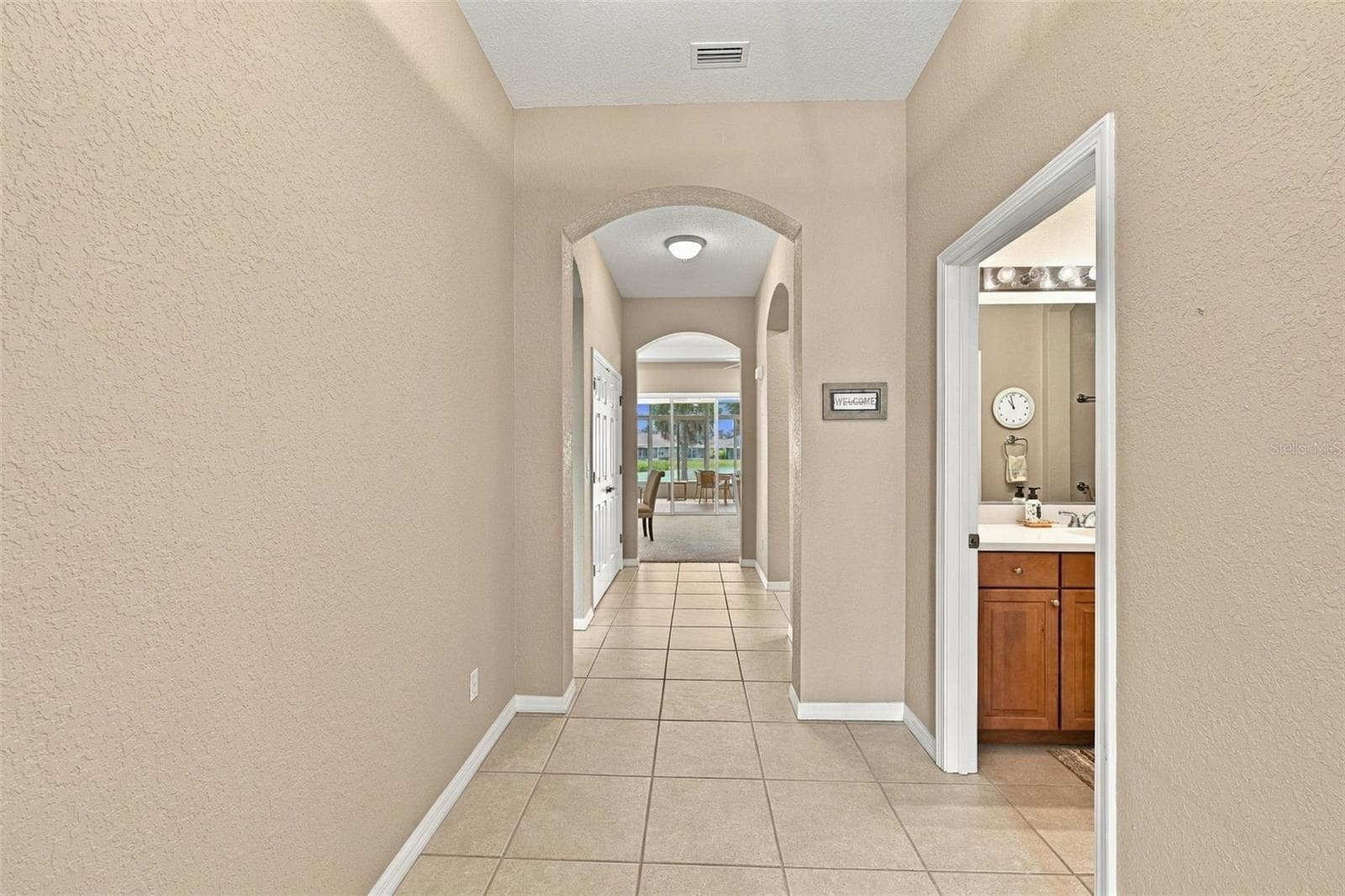 Hallway from the Front Door - 2418 KENSINGTON GREENS DR #9, SUN CITY CENTER