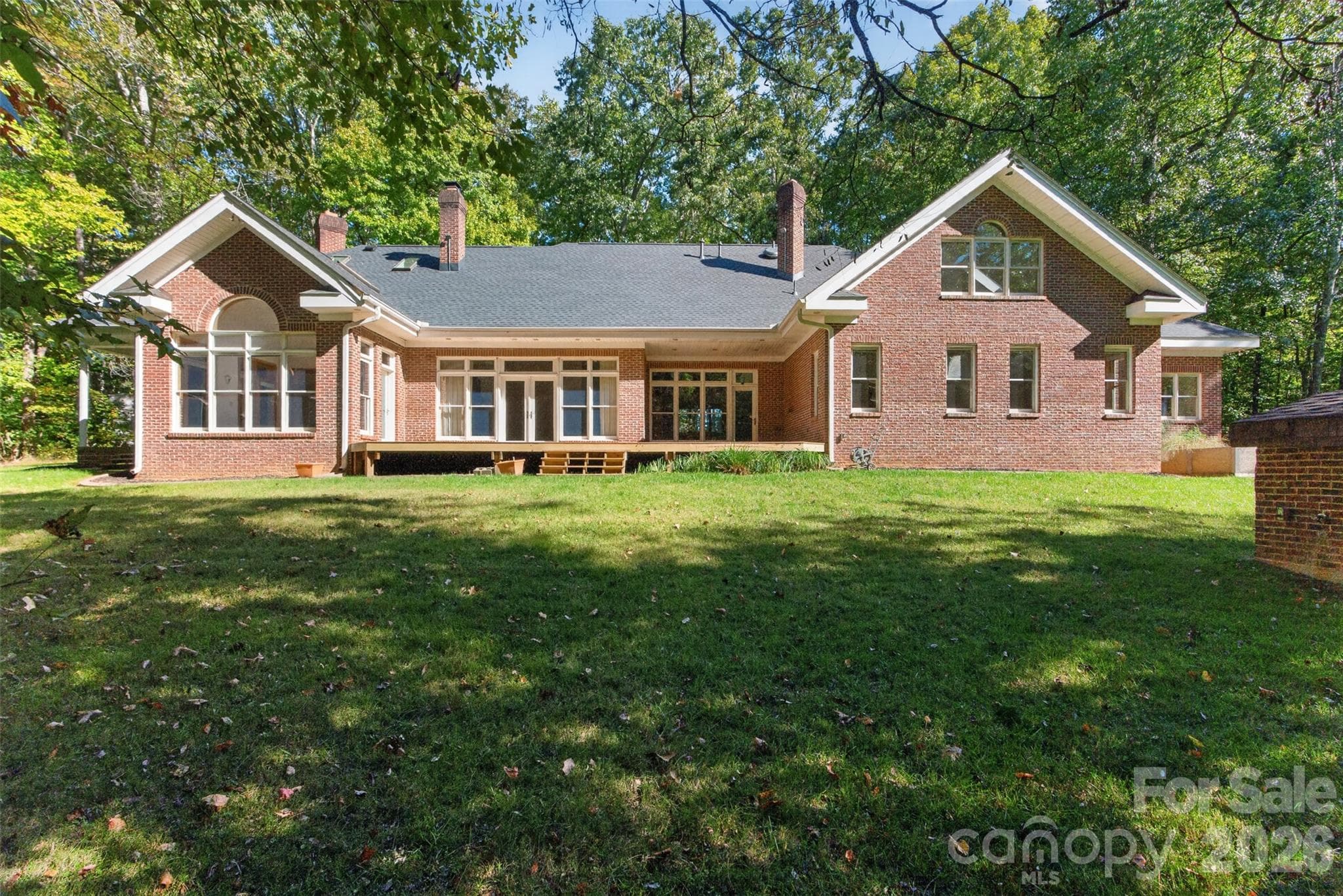rear deck of the estate feeds into open yard and private protected wooded area - 253 Highway 161 South, Clover