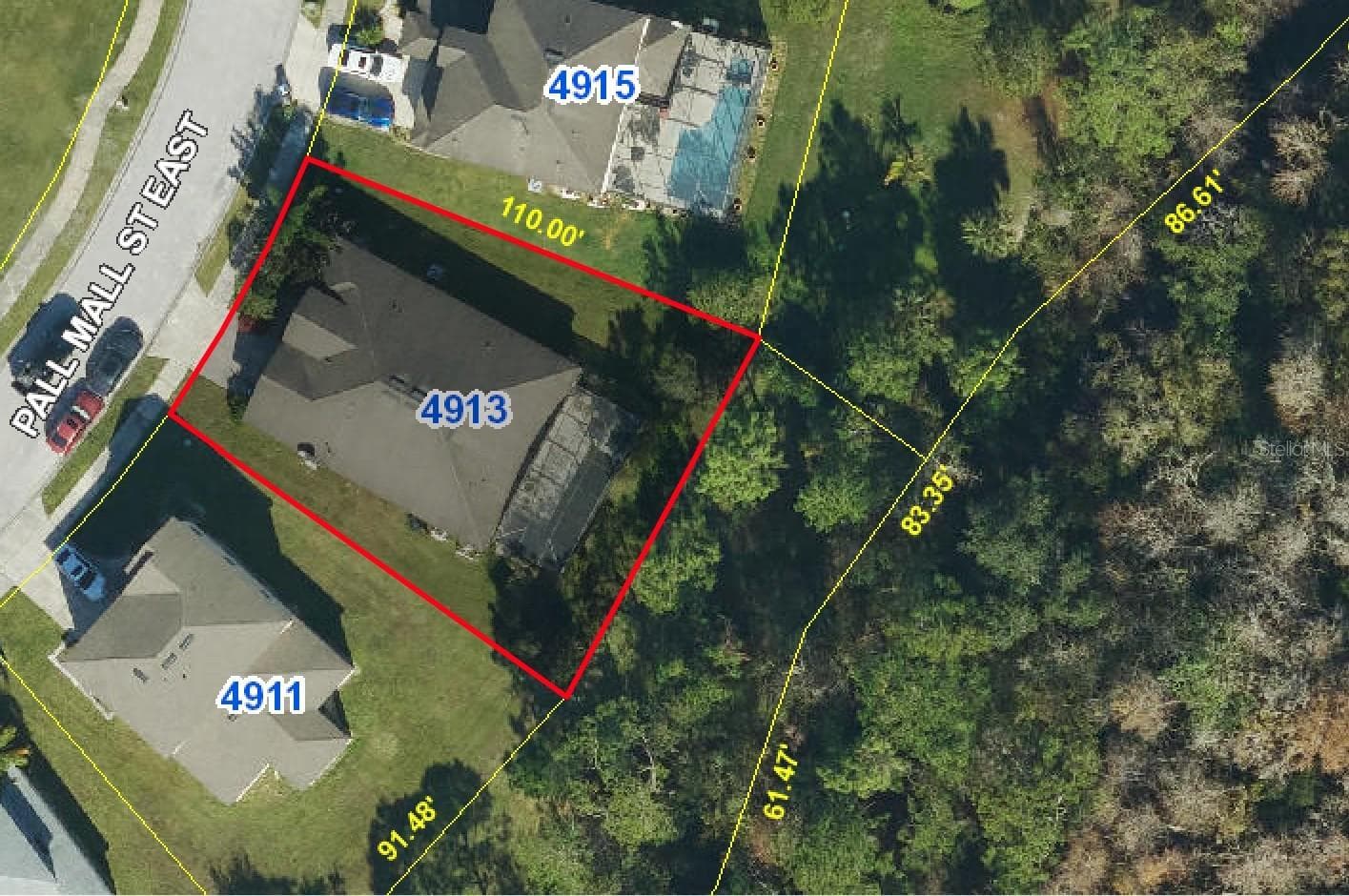 Mature trees offer privacy. Low maintenance home with lawn mowing, shrub trimming, private pool and spa cleaning included in HOA dues. No CDD.www.property-appraiser.org photo. - 4913 PALL MALL ST E, KISSIMMEE