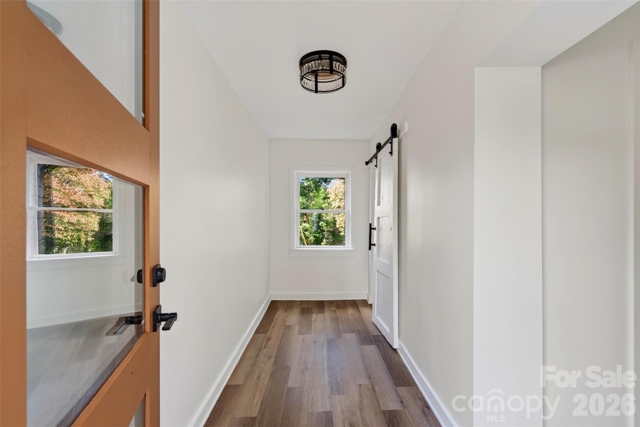 Entry foyer with new flooring and lighting - 64 Pine Cone Drive, Asheville