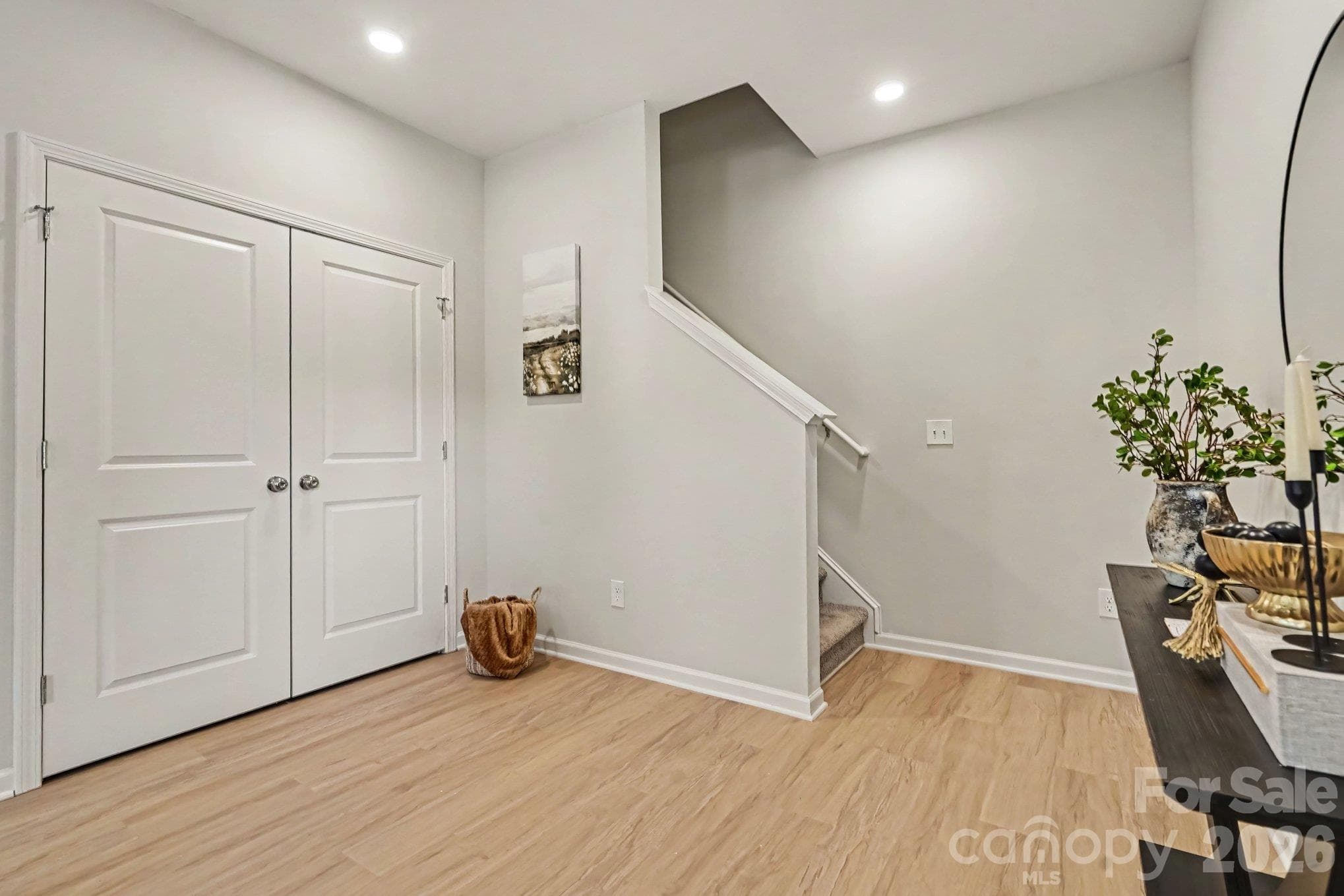 Closet in great room with stairwell to upper level - 121 Buffalo Avenue NW, Concord