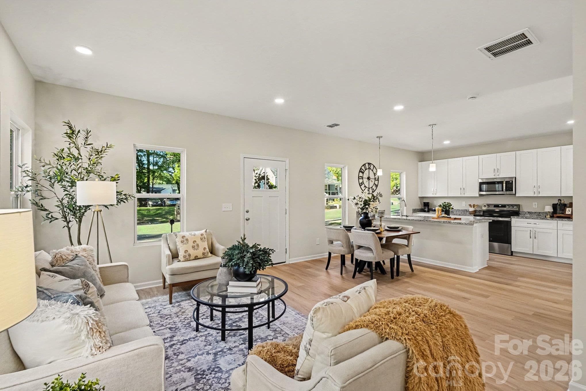 Beautiful open floor plan of great room, and dining area. Kitchen has granite countertops, microwave, electric range, disposal and dishwasher. - 121 Buffalo Avenue NW, Concord