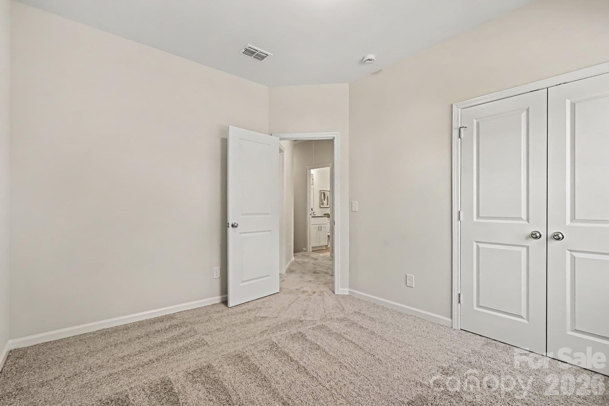 View from front left corner bedroom looking into hallway and second bathroom. - 121 Buffalo Avenue NW, Concord
