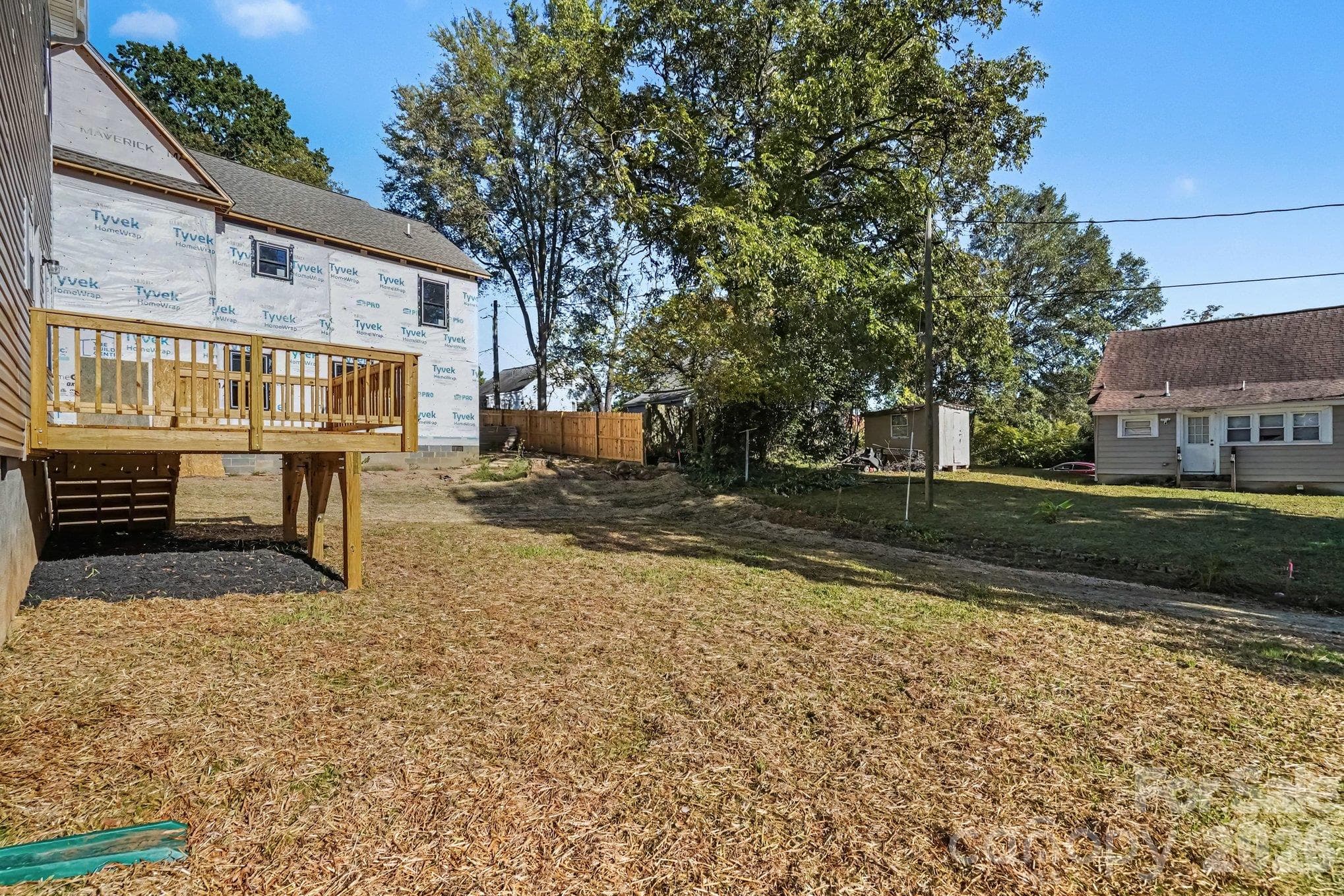 Back yard view of wooden deck. - 121 Buffalo Avenue NW, Concord