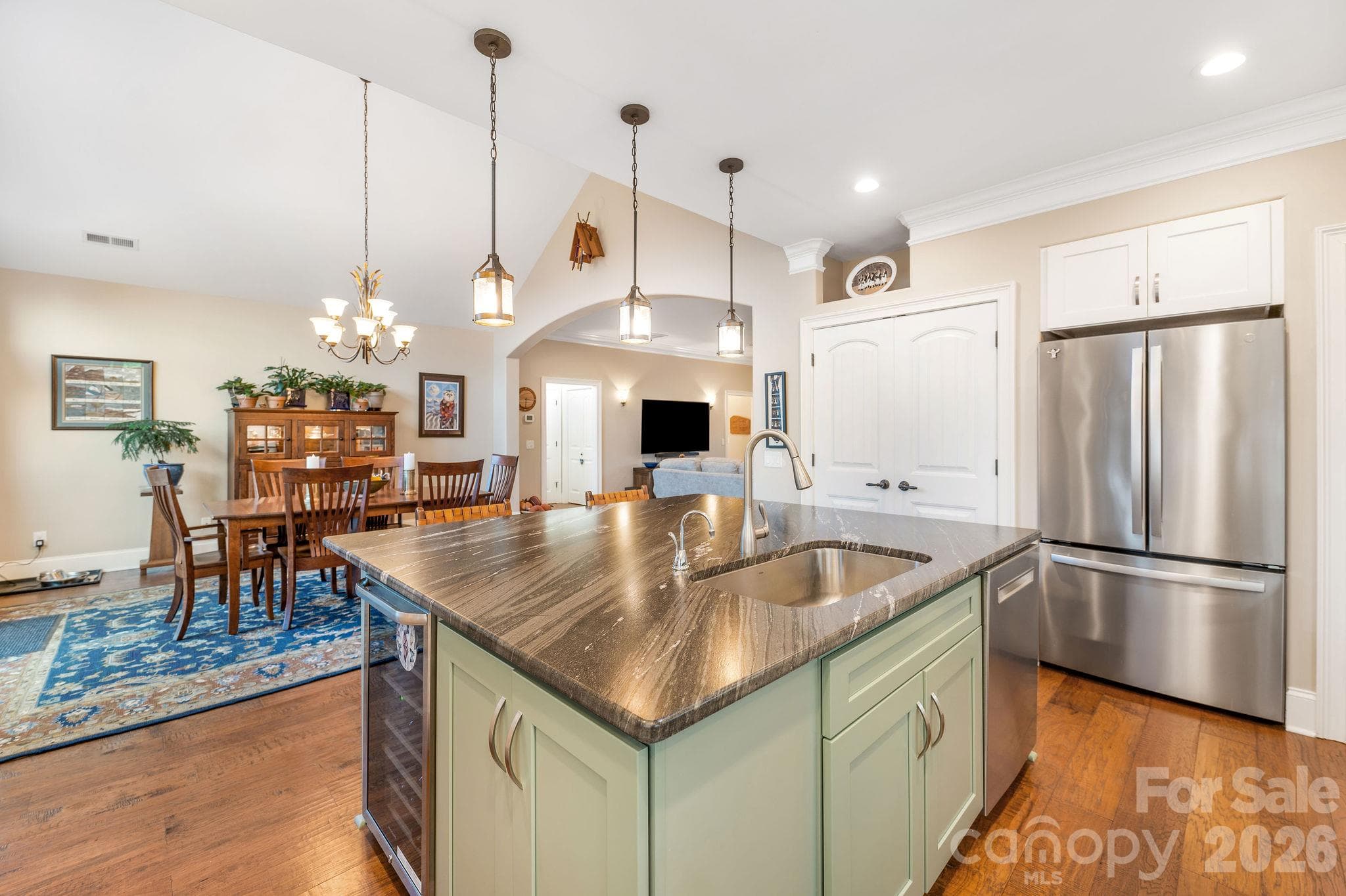 Oversized kitchen island with integrated sink, generous workspace, and seating - 28 Penley Park Drive, Weaverville