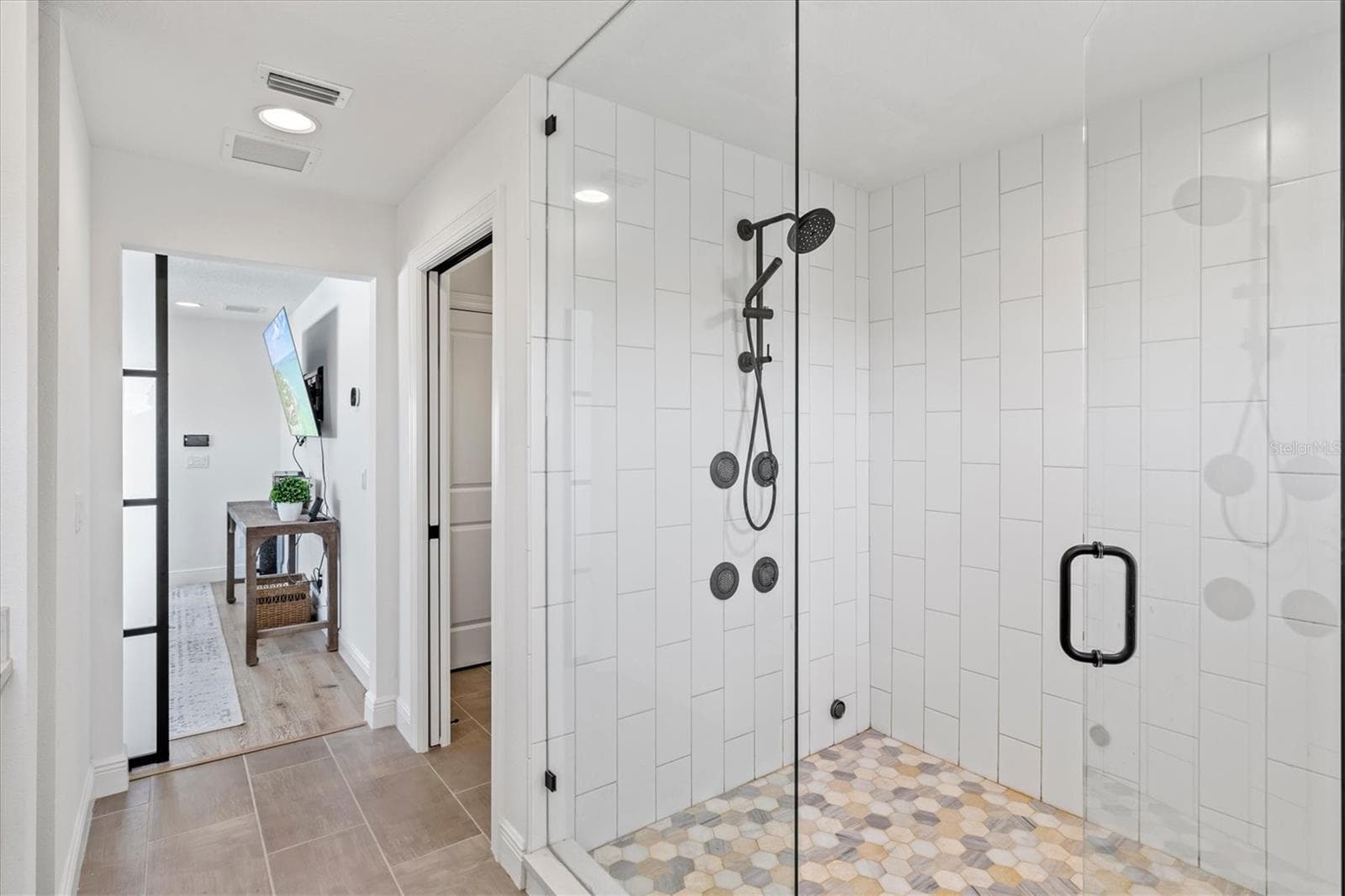 Primary suite bath with steam shower. - 1914 RIVERSIDE DR E, BRADENTON
