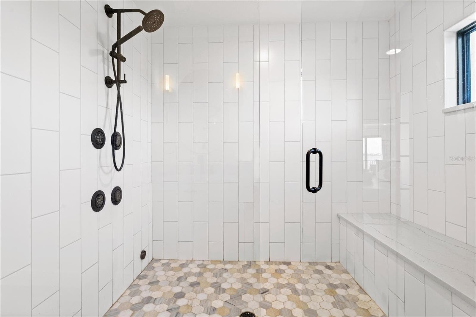 Primary suite bath with steam shower. - 1914 RIVERSIDE DR E, BRADENTON