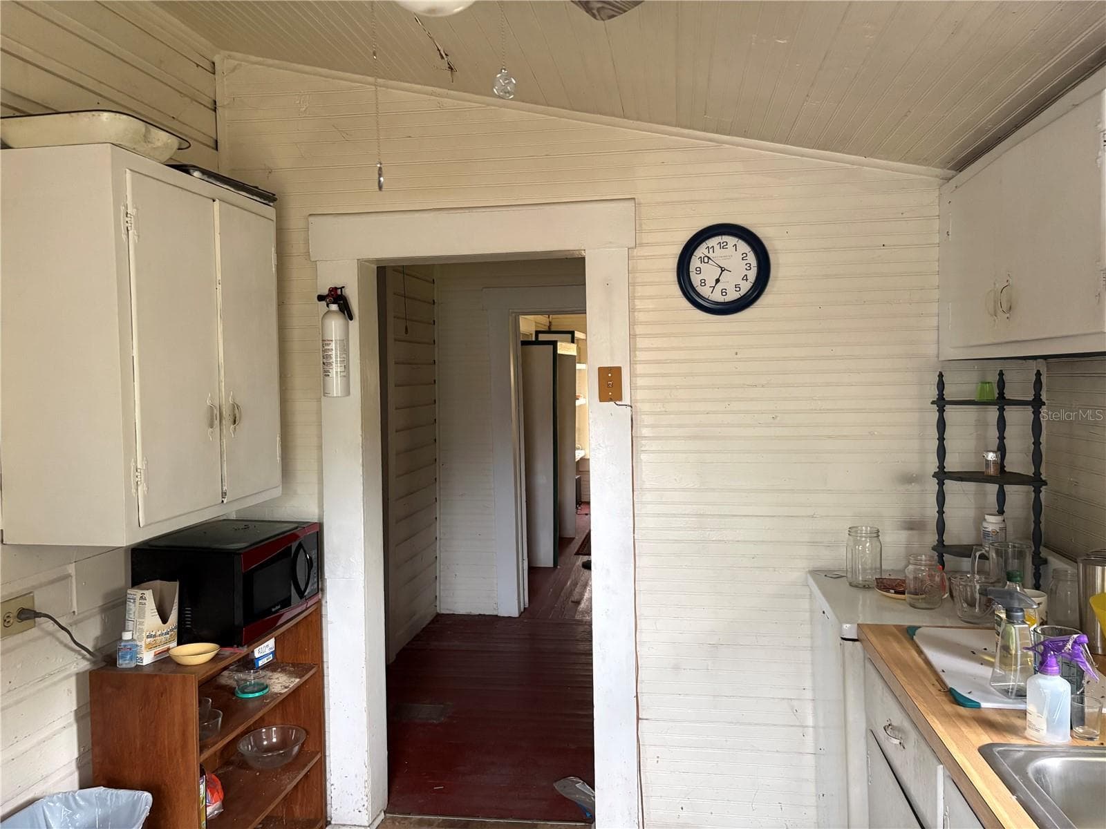 Kitchen looking down hall to Laundry area and office nook. - 3230 SUWANNEE ST, ZOLFO SPRINGS