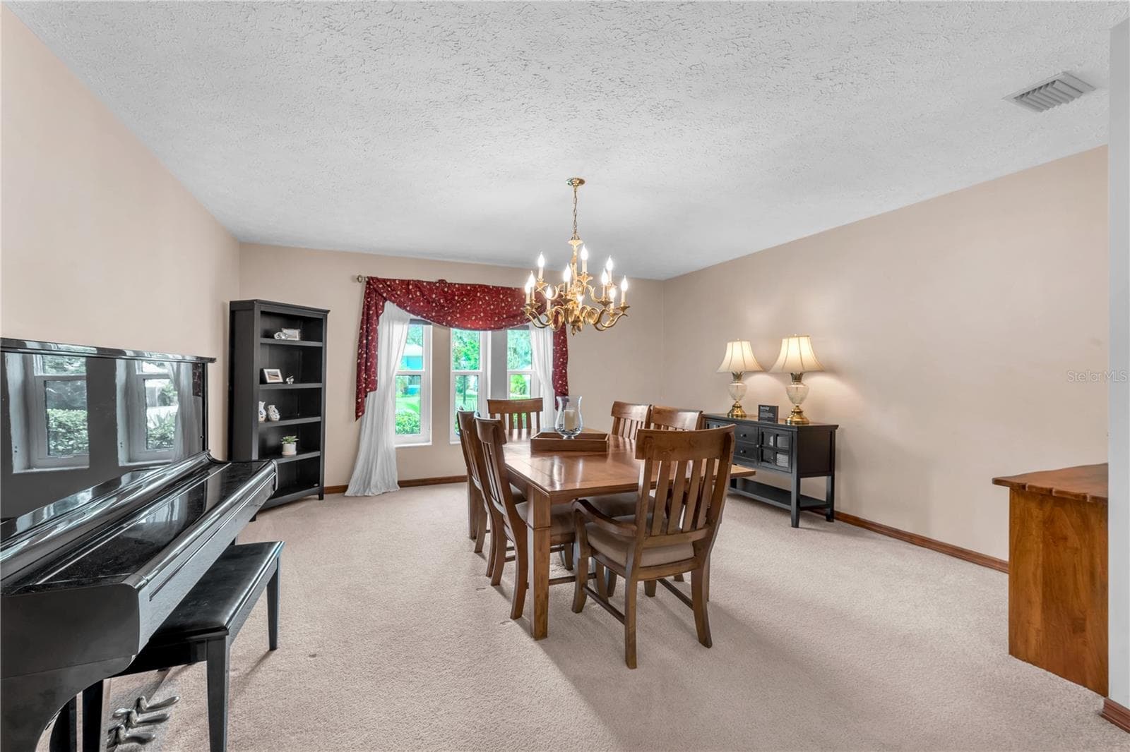 This enormous formal dining room sets the stage for memorable holiday gatherings and dinner parties. - 2421 OAK LANDING DR, BRANDON