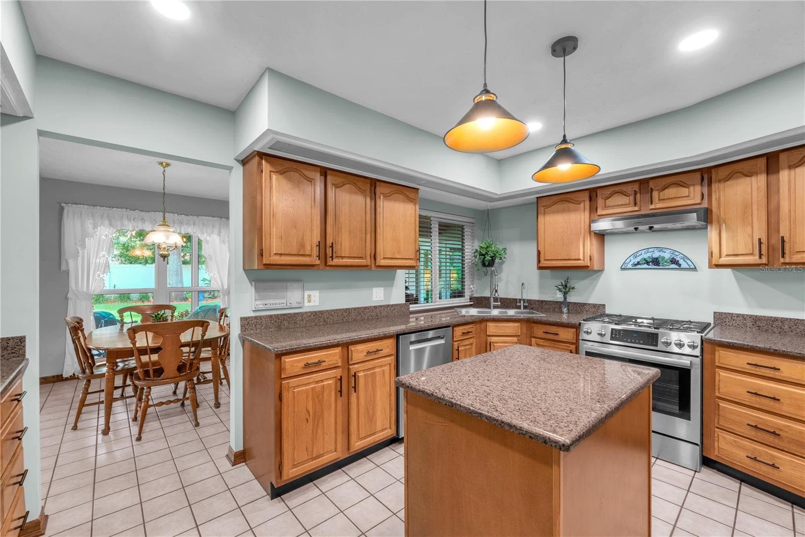 The kitchen features a thoughtfully designed, efficient layout that makes meal preparation easy and convenient. - 2421 OAK LANDING DR, BRANDON