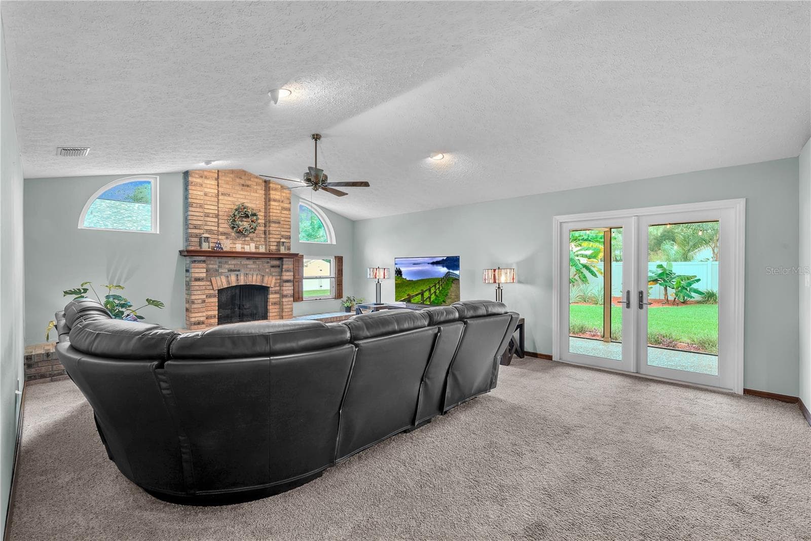A welcoming family room with a gas burning fireplace provides the perfect setting to relax and unwind. - 2421 OAK LANDING DR, BRANDON