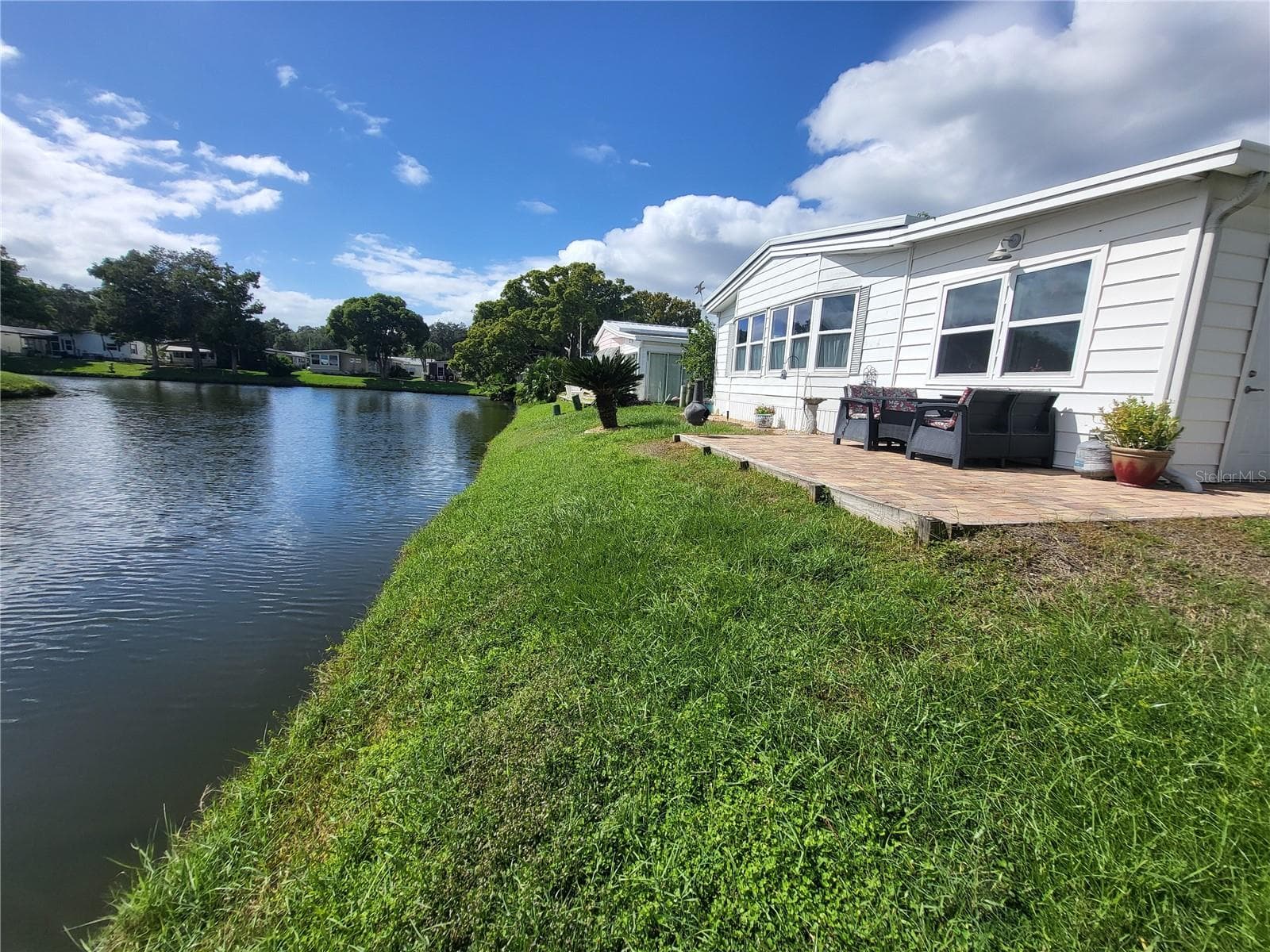 Rear of home on Horsehoe Lake - 176 CLUBVIEW DR #3, SAFETY HARBOR