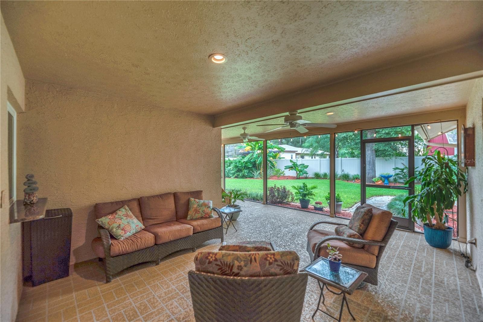 The back patio offers plenty of overhead protection from sudden downpours and protection from direct sunlight. - 2421 OAK LANDING DR, BRANDON