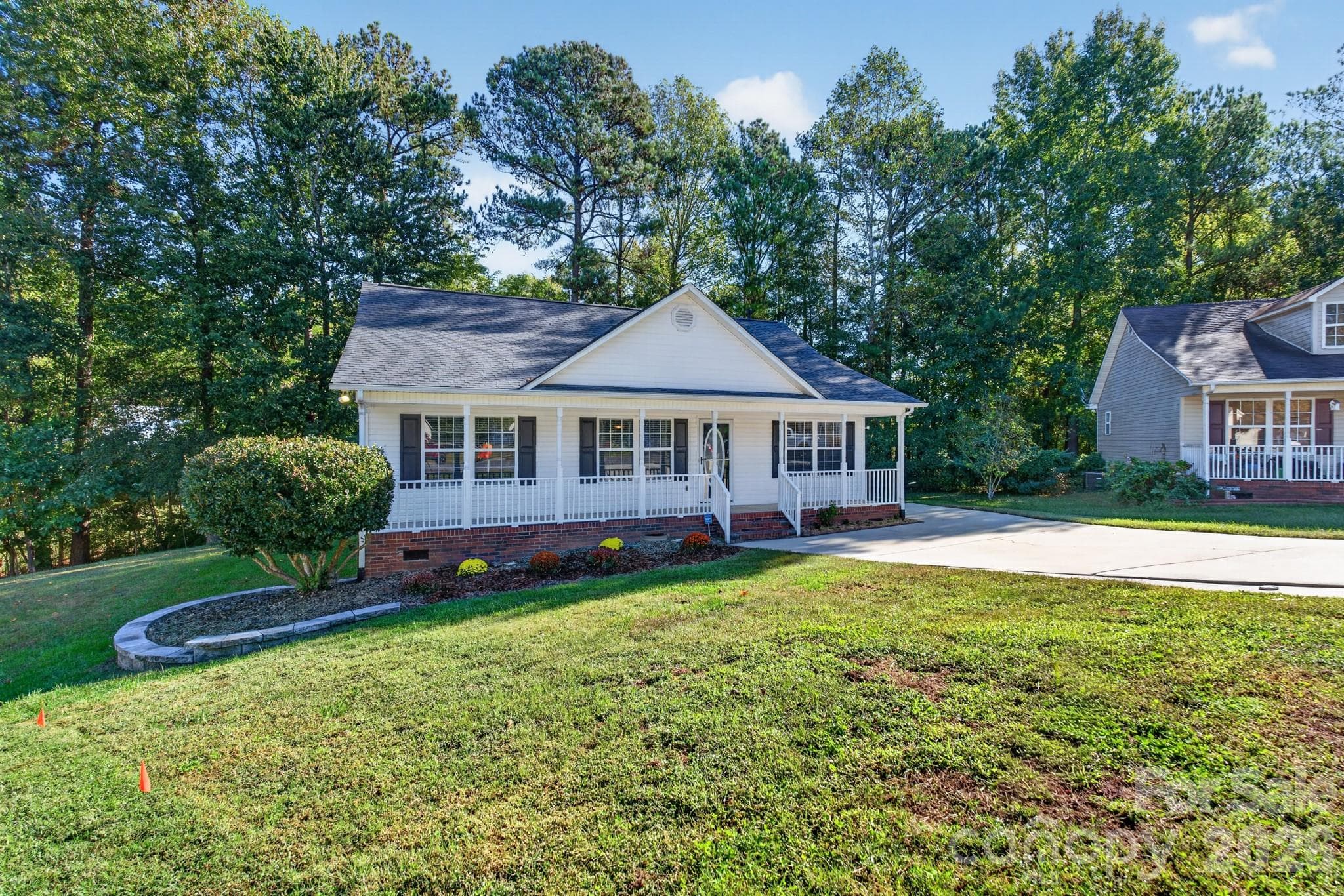 Nestled on a quiet, serene property surrounded by mature trees and lush, low-maintenance landscaping. - 702 Painted Lady Court, Rock Hill