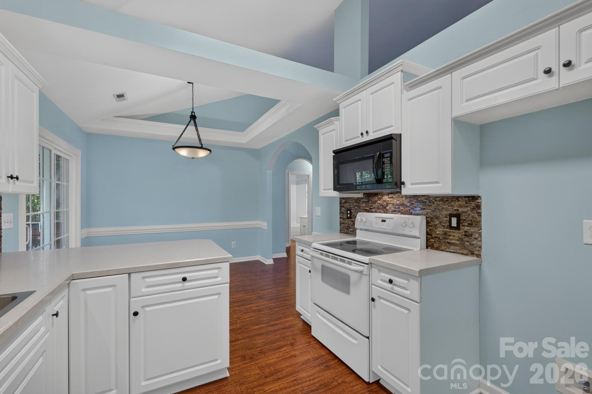 Additional counter space and secondary storage options for kitchen organization. - 702 Painted Lady Court, Rock Hill