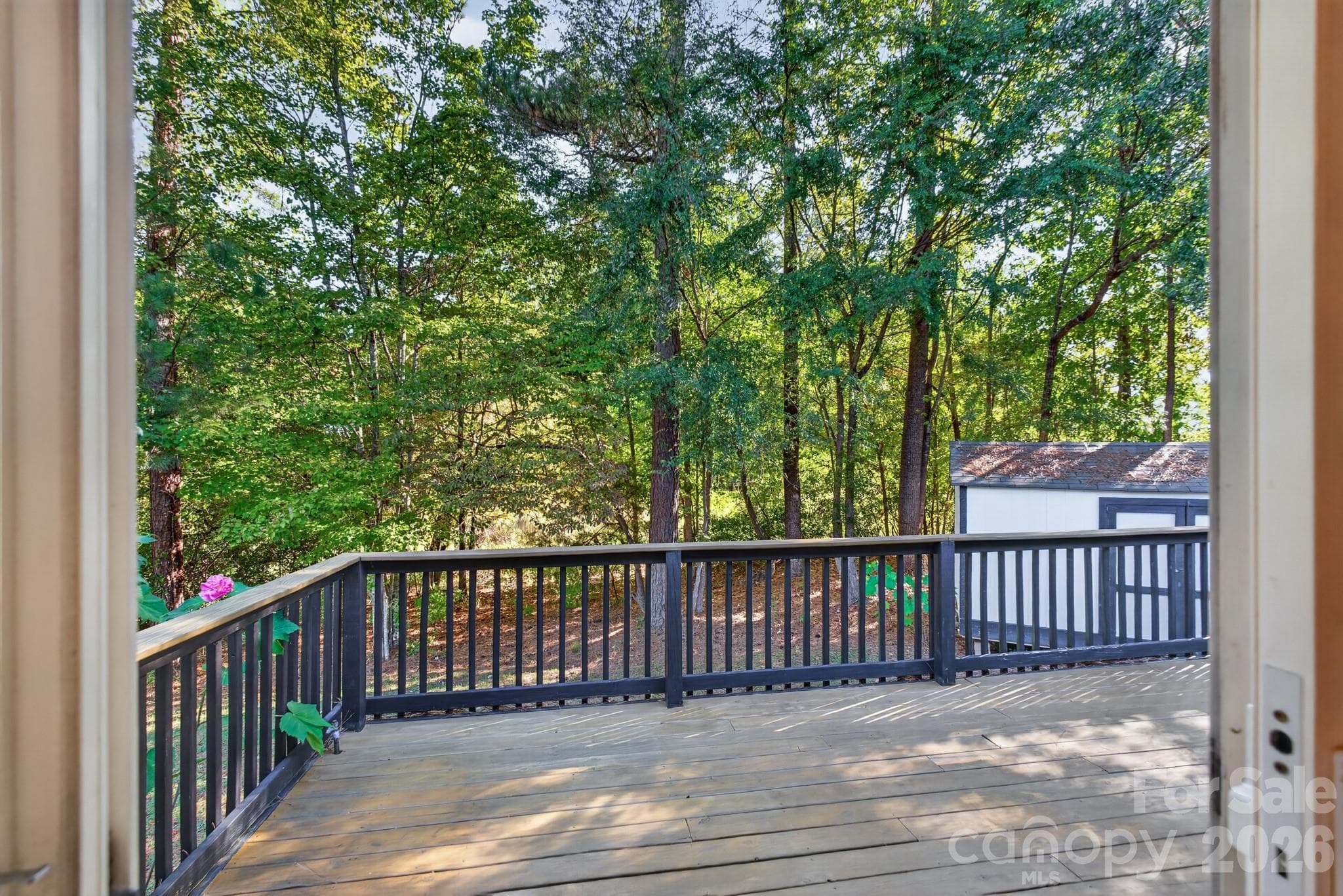 Huge elevated rear deck overlooking a private, tree-lined sanctuary—ideal for summer barbecues. - 702 Painted Lady Court, Rock Hill