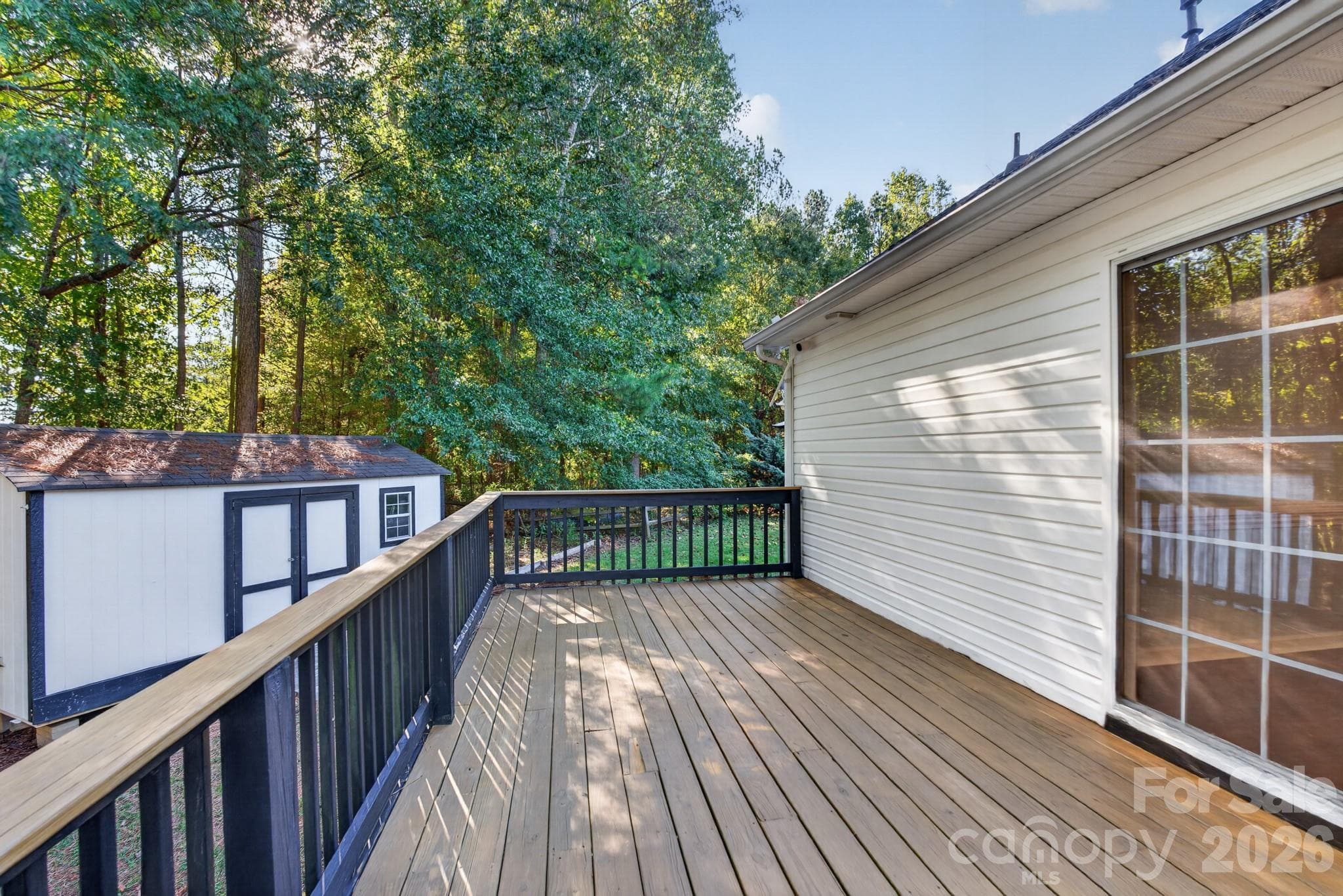 Convenient sliding glass door access directly onto the deck for seamless indoor-outdoor living. - 702 Painted Lady Court, Rock Hill